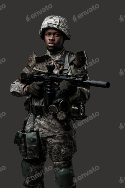 Preview: Army soldier of african ethnic with rifle against grey background