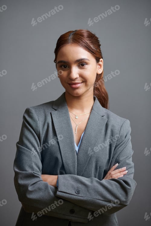 Preview: Professional Woman Posing Confidently in Grey Suit