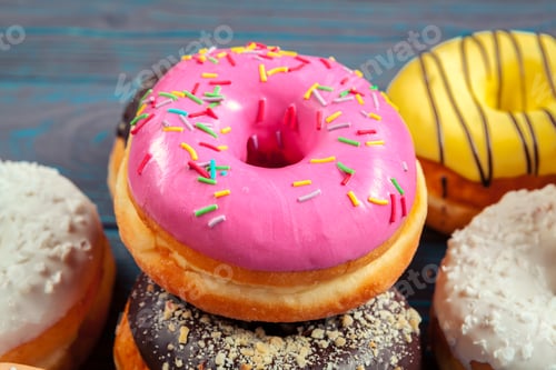Preview: Glazed donuts on wooden background