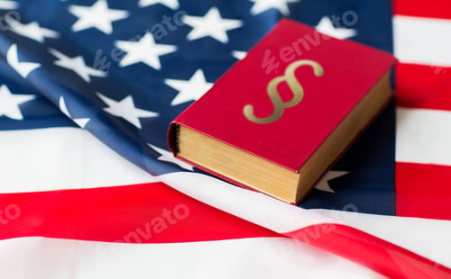Preview: close up of american flag and lawbook