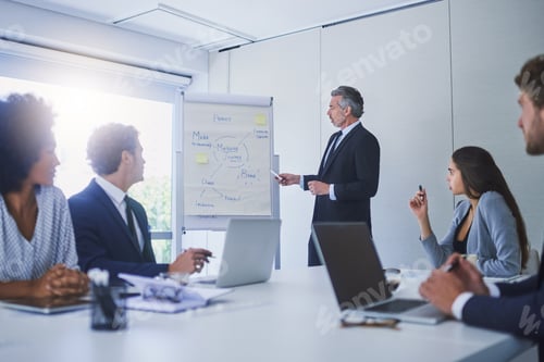 Preview: Shot of a mature businessman giving a presentation to his colleagues in an office