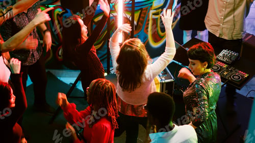 Preview: Group of young people partying at club