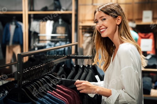 Preview: Portrait of happy woman shopping clothes in a store. Shopping people sale fashion concept