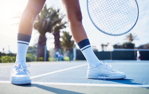 Preview: Shot of a unrecognizable a woman standing in a tennis court