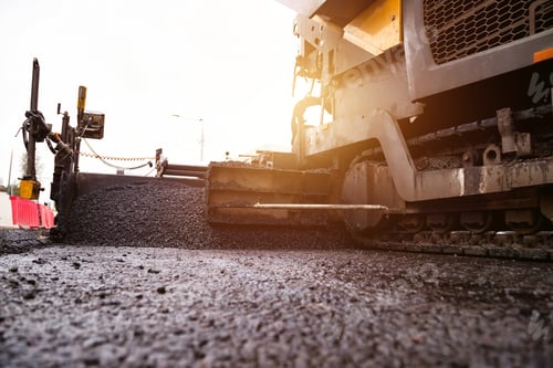 Preview: Industrial Paver Laying Fresh Asphalt on a Metropolis City Street