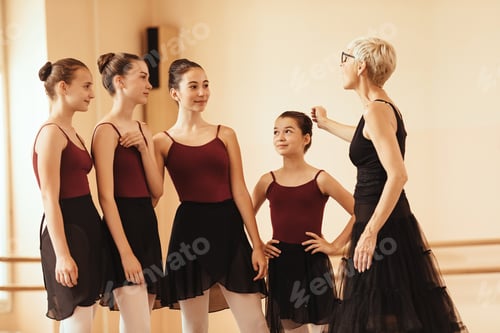 Preview: Ballet teacher communicating with ballerinas after the rehearsal.