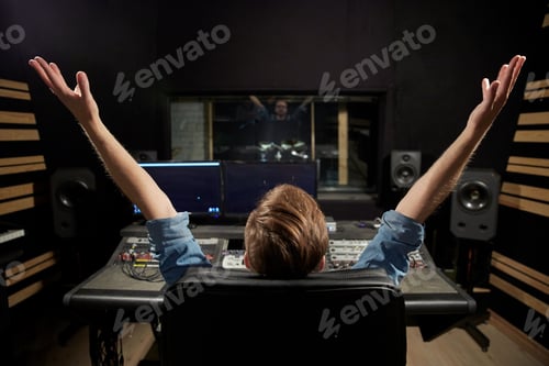 Preview: man at mixing console in music recording studio