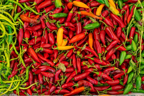 Preview: Chili and bell peppers assortment on vegetable market