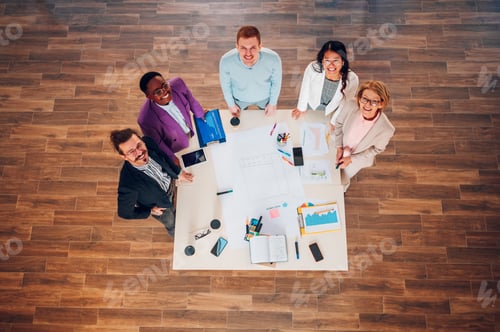 Preview: High angle of a multiracial business people having a meeting in an office