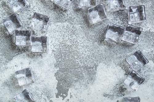 Preview: Ice Cubes. Artificial Crystal Clear Transparent Piece. Concept. Food Background. Top View. Copy