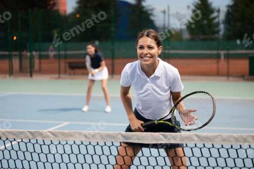 Preview: Fit happy poeple playing tennis together. Sport concept