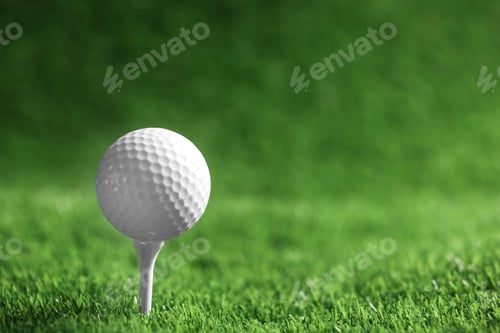Preview: Golf ball with tee on artificial grass, space for text