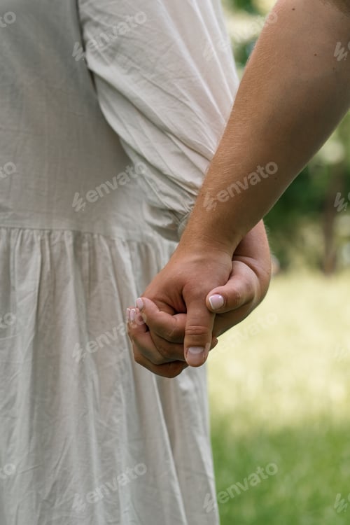 Preview: hands of couple in love close-up couple holding hands concept of support care love happy family