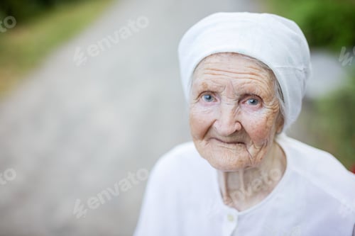 Preview: Smiling senior woman outdoors