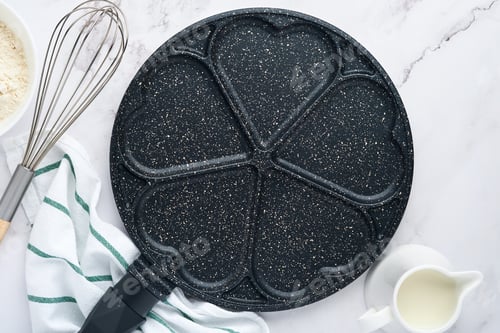 Preview: Empty frying pan black, skillet with stone nonstick coating for baking pancakes in shape of breakfas