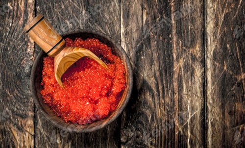 Preview: red caviar in a bowl with a shovel.