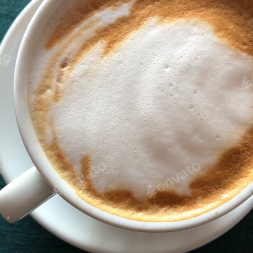 Foamy Coffee Cup with Latte Art Closeup