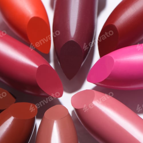 Preview: Closeup shot of colorful lipsticks isolated on white background