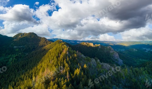 Preview: Valley of Balkan mountains with fog, sunny clouds and forests. Village Pamporovo. Panorama