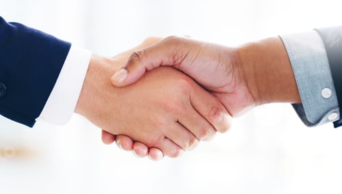 Preview: Cropped shot of two businessmen shaking hands in a modern office