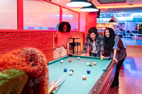 Preview: Friends playing billiards and having fun in bowling alley
