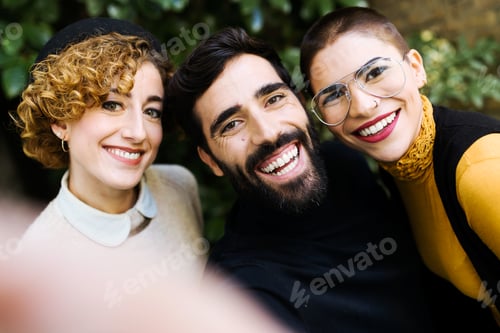 Preview: Smiling friends making selfie