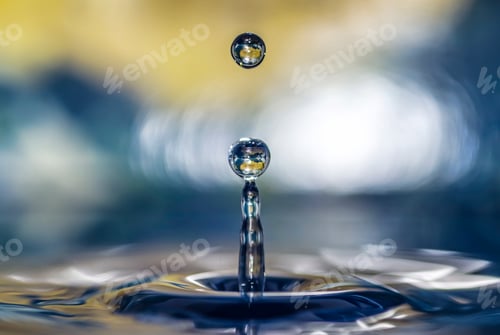 Preview: Macro of a drop of water reflecting on a world map