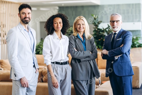 Preview: Confident, professional business team smiling in modern office lobby
