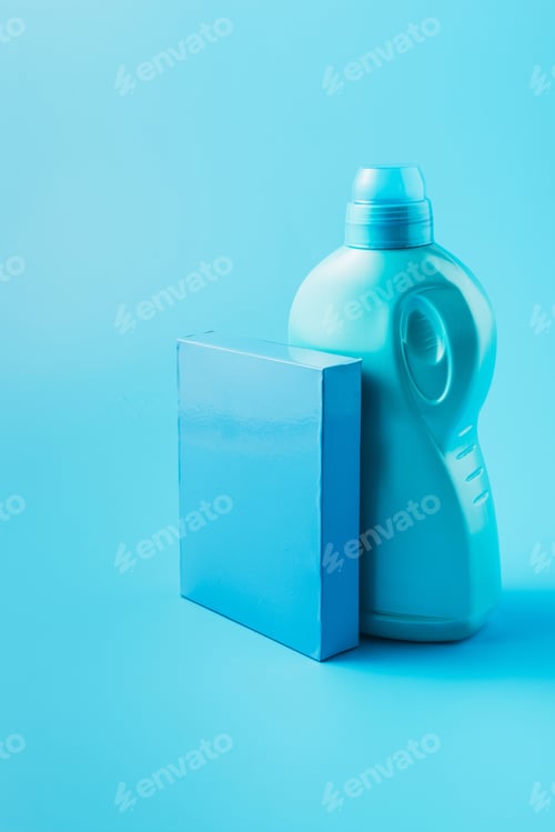 Preview: close up view of washing powder and laundry liquid, blue background