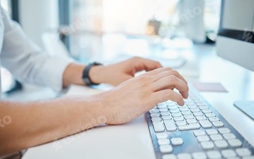 Preview: Closeup of mans hands typing on a keyboard of computer in corporate, creative and business office.