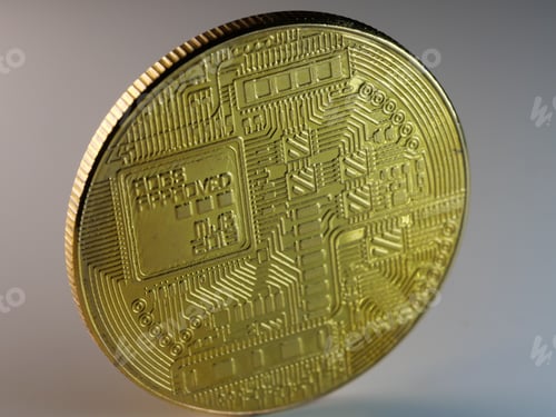 Preview: Closeup shot of the backside of a bitcoin on white background
