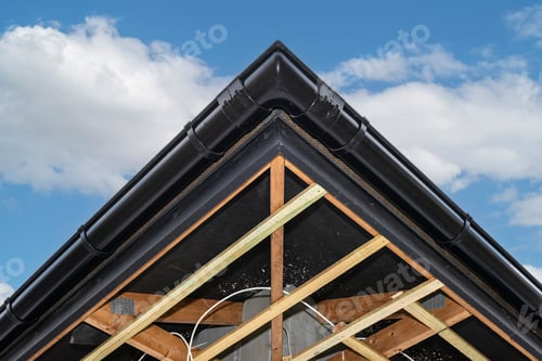 Preview: Scaffolding with three rows of wooden battens for attaching the PVC soffit