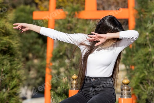 Preview: a young girl at the park doing dab