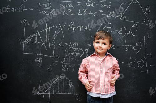 Preview: What a little genius. Studio shot of a young boy with a blackboard full of math equations.