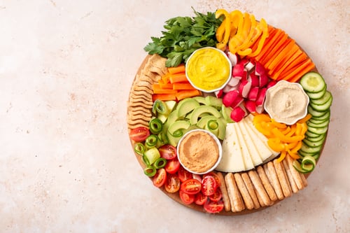 Preview: Colorful vegan Charcuterie board with raw vegetables and whole wheat snacks