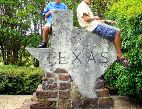 Preview: Boys sitting on a Texas map structure during a Texas trip USA travel