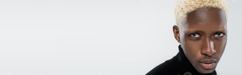 Preview: portrait of blonde african american man with blue eyes isolated on grey, banner