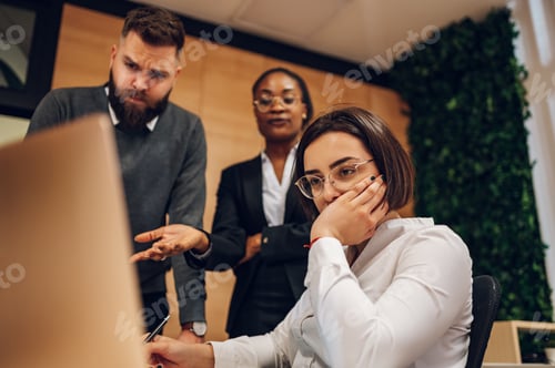 Preview: Stressed business team having a meeting in the office and solving a problem
