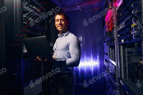 Preview: Joyous system administrator with laptop colocation data center