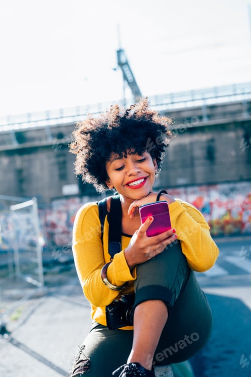 Preview: Black woman using smartphone