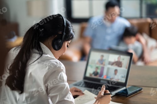 Preview: Asian business woman talking to colleague team about plan in video conference.
