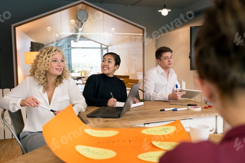 Preview: Business people attending a workshop in the office