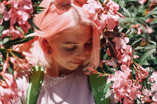 Preview: Woman with pink hair, pink oleander, colorful hair