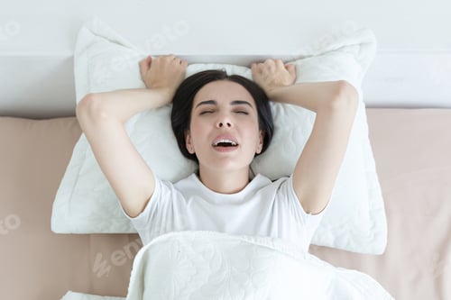 Preview: A beautiful woman lies in bed, enjoys an orgasm, alone at home