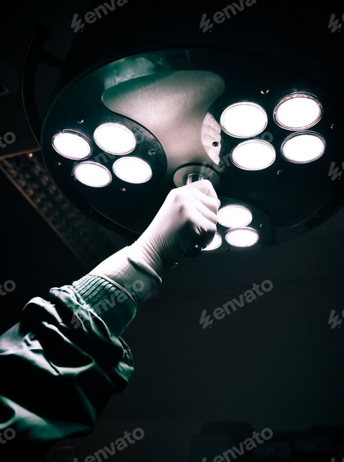 Preview: Surgical Hand Adjusting a Powerful Operation Room Light