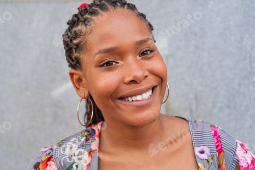 Preview: African woman taking selfie in the street