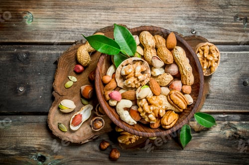 Preview: Different kinds of nuts in bowl with leaves.
