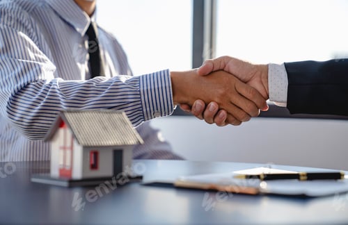Preview: real estate businesspeople shaking hands in office for business merger teamwork successful negotiati