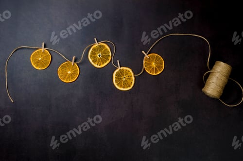 Preview: Dried Orange Slices on Twine with Wooden Clothespins