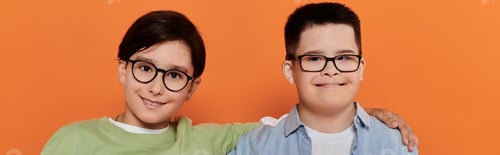 Preview: Boy With Down Syndrome Smiles With Friend at Home